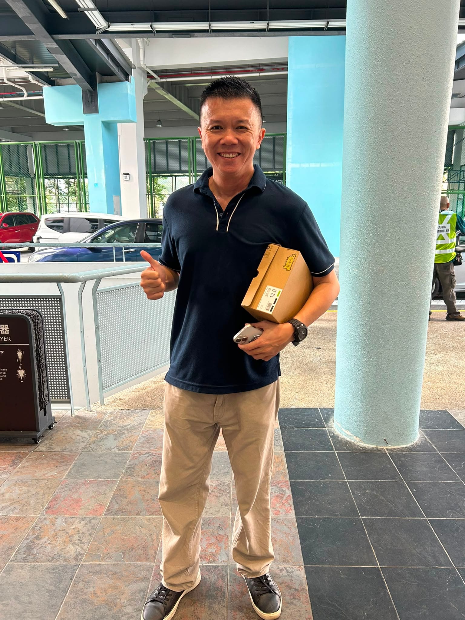 teacher with shoebox